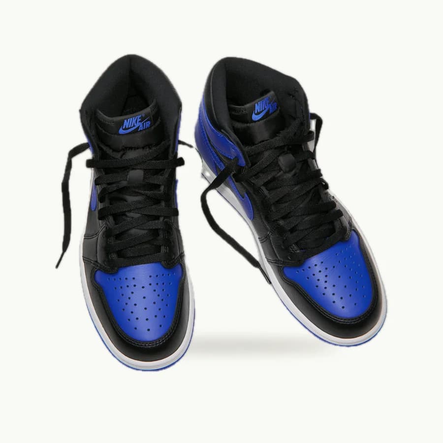 Air Jordan 1 Retro High OG: A pair of black and royal blue Air Jordan 1 High OG shoes from a raised three-quarter angle