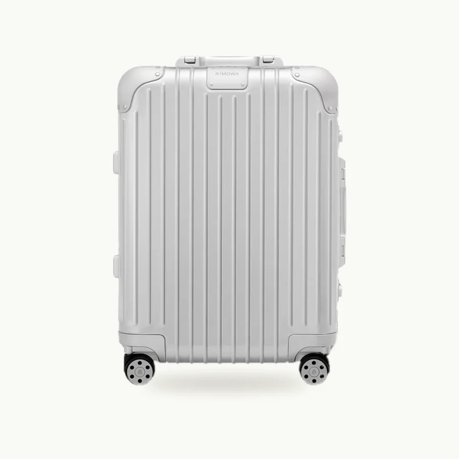 Original Cabin Suitcase: Silver Original Cabin aluminum suitcase with its handle retracted, front view